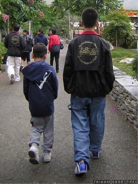 brotherly syncronized walking. how do you spell syncronized