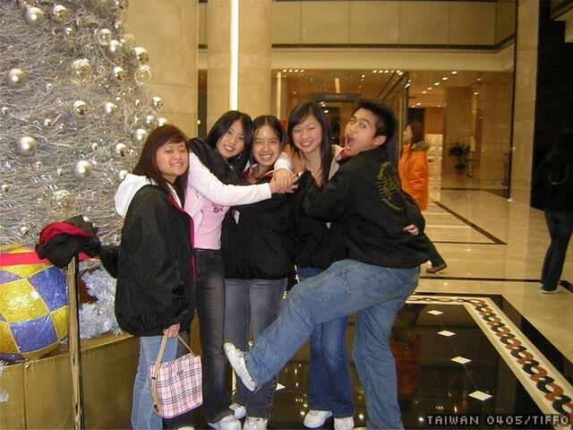 a bunch of girls with the christmas tree at sogo