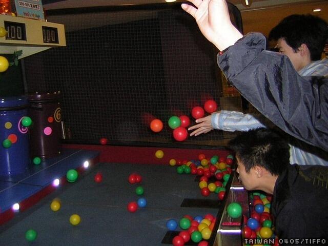 throwing balls into trashcans like crazy.